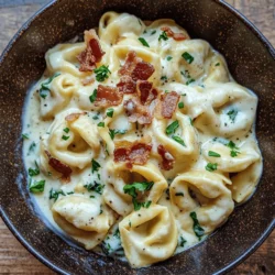 Creamy Bacon Tortellini Alfredo is a dish that embodies the essence of comfort food, combining rich, velvety textures with savory flavors that tantalize the taste buds. This indulgent pasta dish is perfect for cozy weeknight dinners, special occasions, or a satisfying meal that feels like a warm hug on a plate. The creamy Alfredo sauce, enhanced by the savory notes of crispy bacon, envelops the tortellini, creating a delightful culinary experience that is both familiar and luxurious.