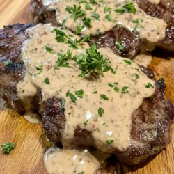 The star of this dish is undoubtedly the ribeye steak. Renowned for its marbling and tenderness, the ribeye cut is a favorite among steak enthusiasts. This cut comes from the rib section of the cow and is characterized by its rich flavor and juicy texture. The marbling, or intramuscular fat, not only adds to the steak's flavor but also ensures that it remains moist during cooking.